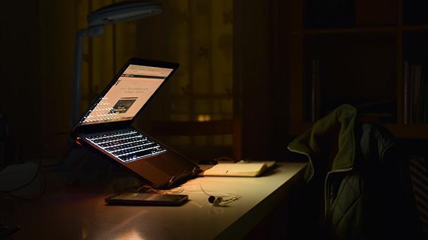 A laptop in a dark room